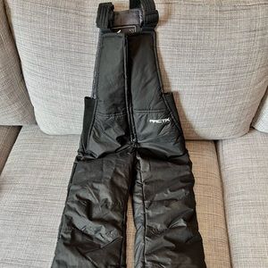Arctix black snow pants bib style. Like new. Size xxs (4/5) boys or girls